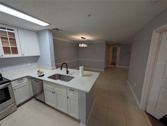 kitchen featuring white cabinetry, appliances with stainless steel finishes, kitchen peninsula, and sink