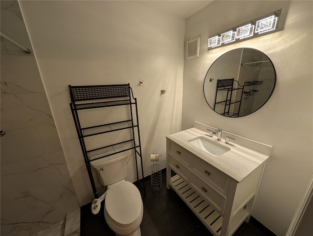 bathroom with vanity and toilet