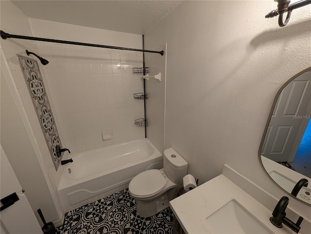 full bathroom with tile patterned flooring, vanity, a textured ceiling, tiled shower / bath, and toilet