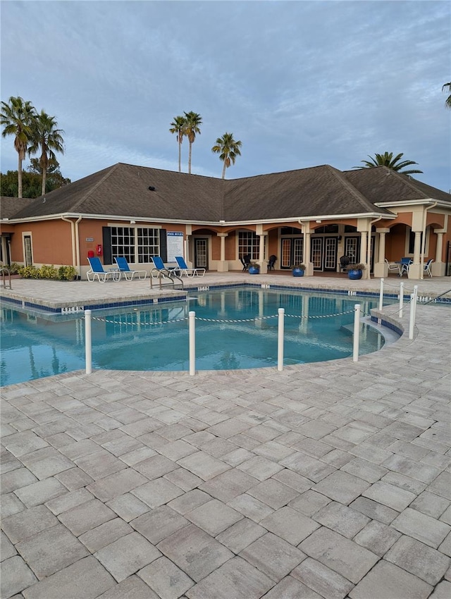 view of swimming pool with a patio