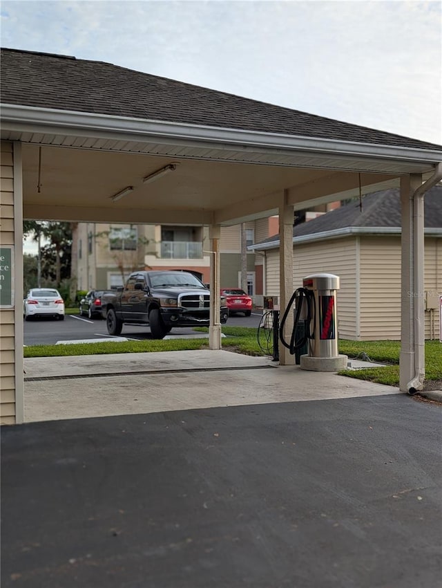 view of vehicle parking featuring a carport