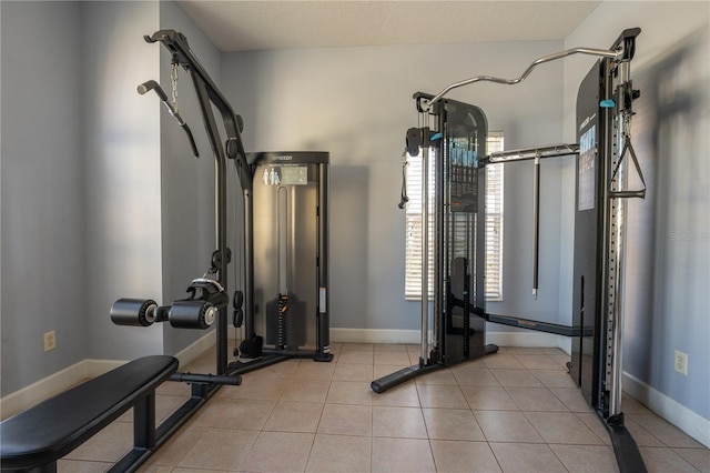 exercise room with a textured ceiling