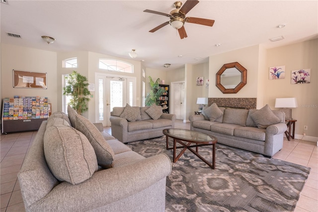 living room featuring ceiling fan and light tile patterned floors