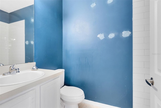 bathroom featuring vanity and toilet