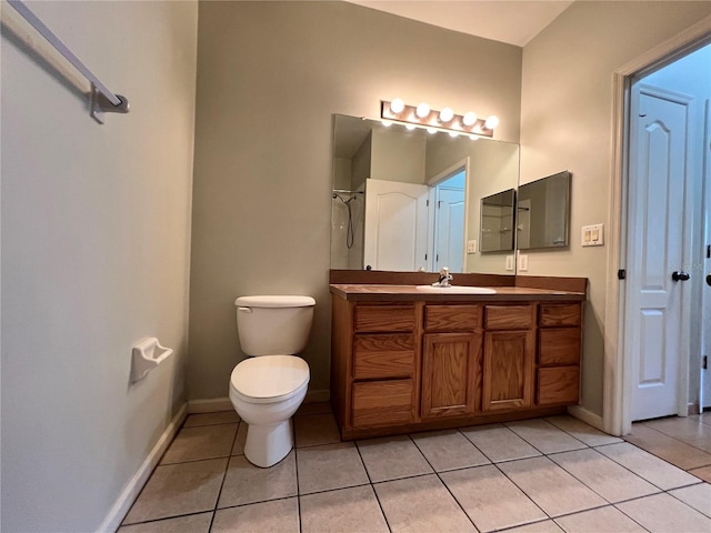 bathroom with tile patterned flooring, vanity, toilet, and walk in shower