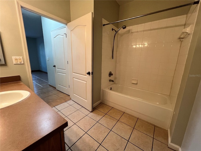 bathroom with vanity, tiled shower / bath combo, and tile patterned floors