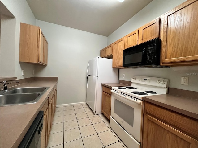 kitchen with sink, light tile patterned floors, and black appliances