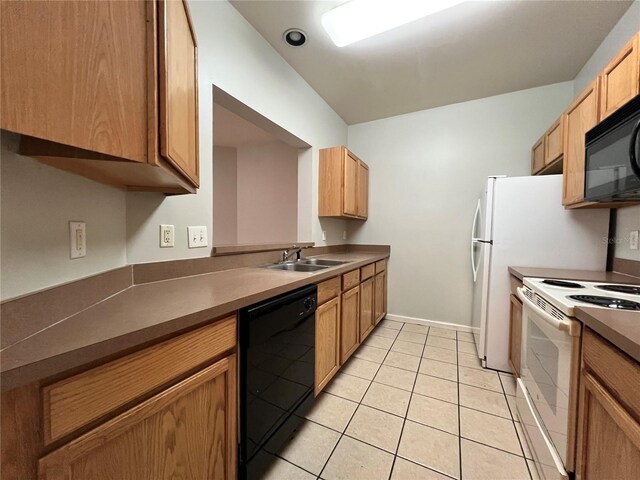 kitchen with sink, light tile patterned floors, and black appliances