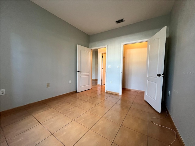 unfurnished bedroom featuring light tile patterned floors