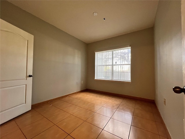 empty room with light tile patterned flooring