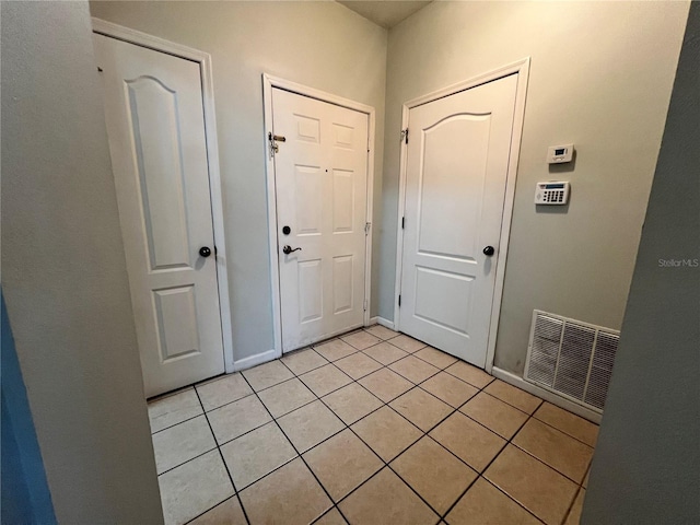 interior space with light tile patterned floors