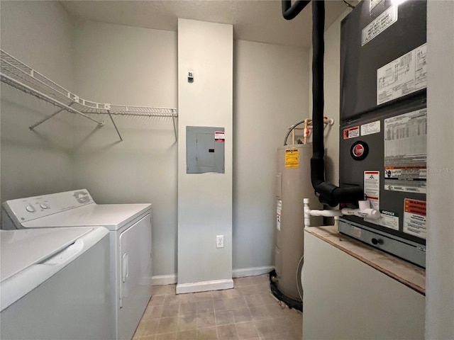 clothes washing area featuring water heater, separate washer and dryer, heating unit, and electric panel