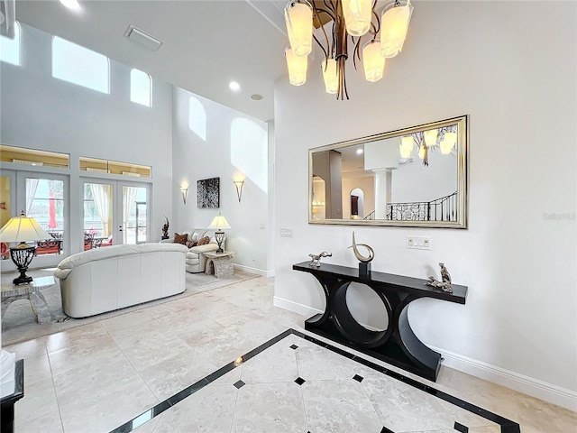 bathroom featuring french doors, recessed lighting, visible vents, a high ceiling, and baseboards