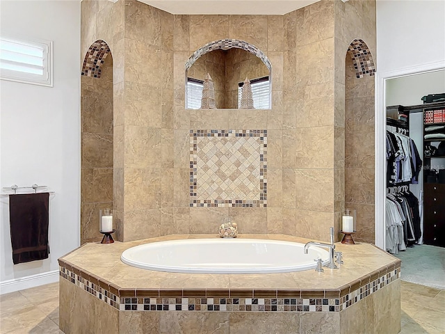 bathroom with tiled bath