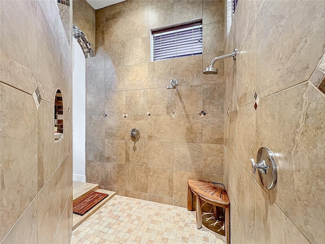 bathroom featuring a tile shower