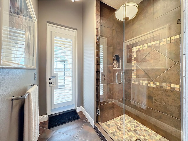 bathroom featuring tile patterned flooring and walk in shower