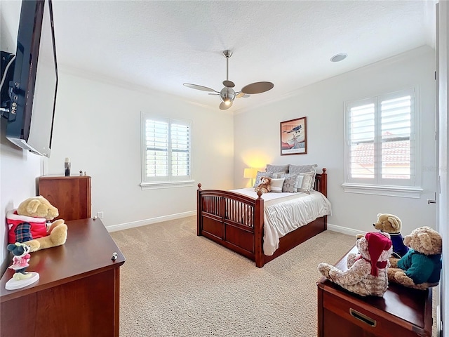 bedroom with multiple windows, ceiling fan, ornamental molding, and light carpet