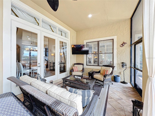 view of patio / terrace with outdoor lounge area, ceiling fan, and french doors