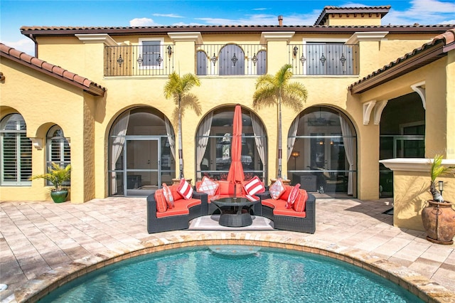 back of house featuring an outdoor hangout area and a patio area