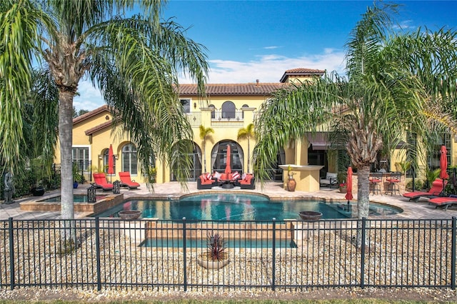 view of pool featuring an in ground hot tub and a patio area