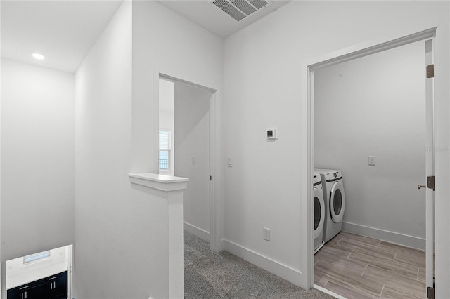 washroom featuring laundry area, independent washer and dryer, baseboards, and visible vents