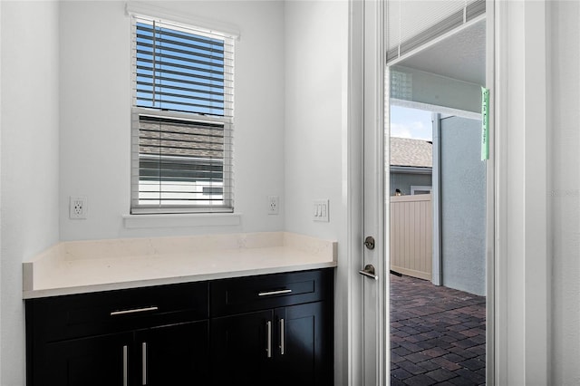 bathroom with brick floor