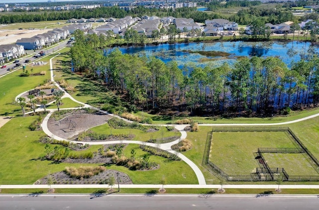 bird's eye view featuring a residential view and a water view