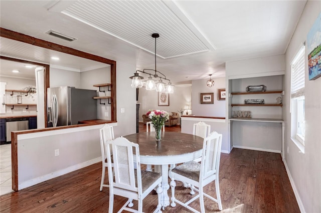 dining area with hardwood / wood-style floors