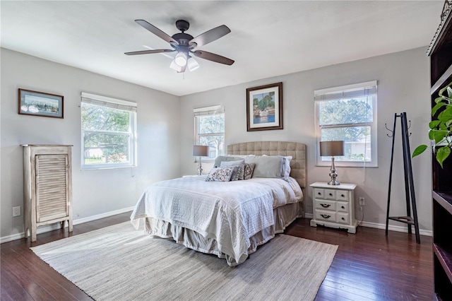 bedroom with dark wood-type flooring and ceiling fan