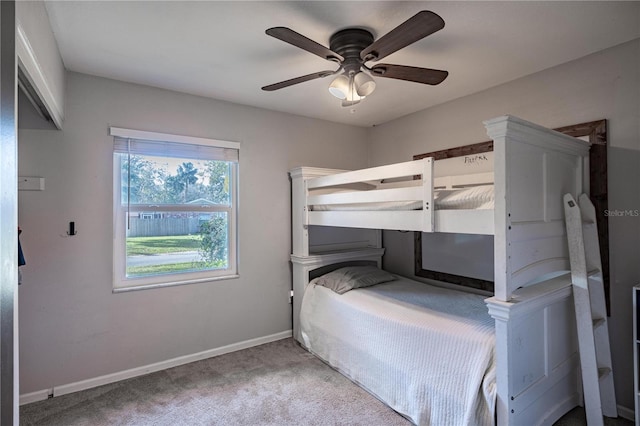 bedroom featuring light carpet and ceiling fan