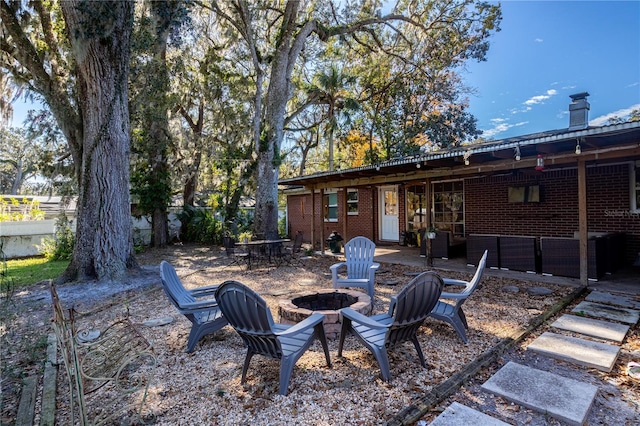 view of patio with an outdoor fire pit