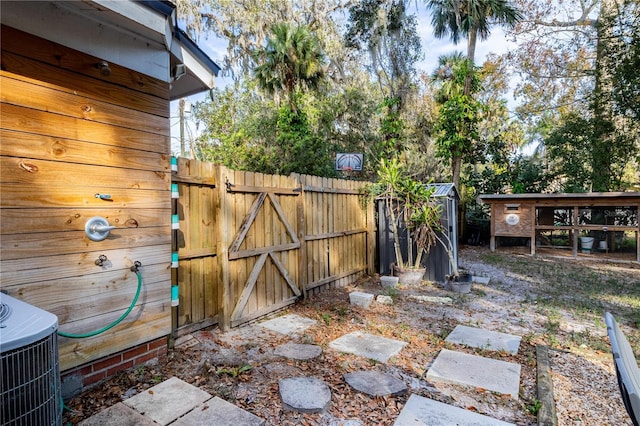 view of patio with an outdoor structure and central air condition unit