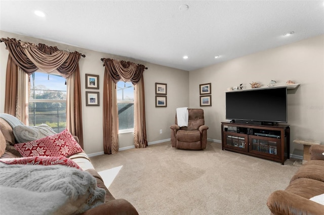 living room featuring a healthy amount of sunlight and light colored carpet