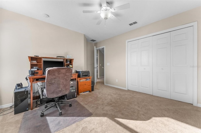 office area with carpet and ceiling fan