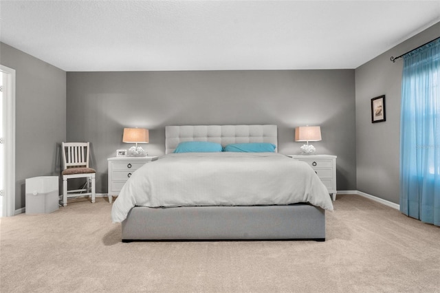 carpeted bedroom featuring multiple windows