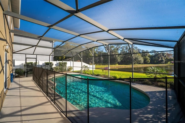 view of pool with a water view, a lanai, and a patio