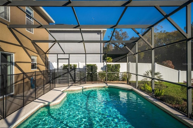 view of pool with a lanai