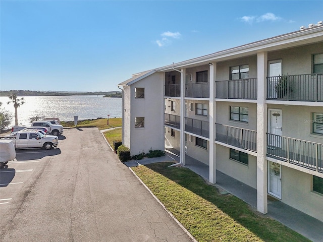 view of building exterior with a water view