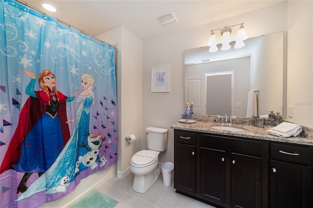 full bathroom featuring vanity, tile patterned floors, toilet, and shower / bath combo with shower curtain