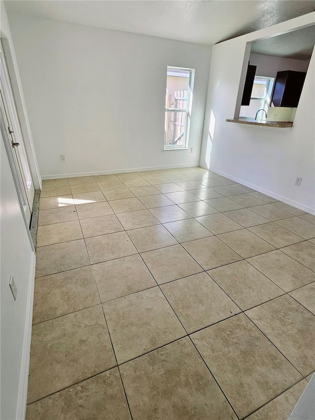 empty room with light tile patterned flooring