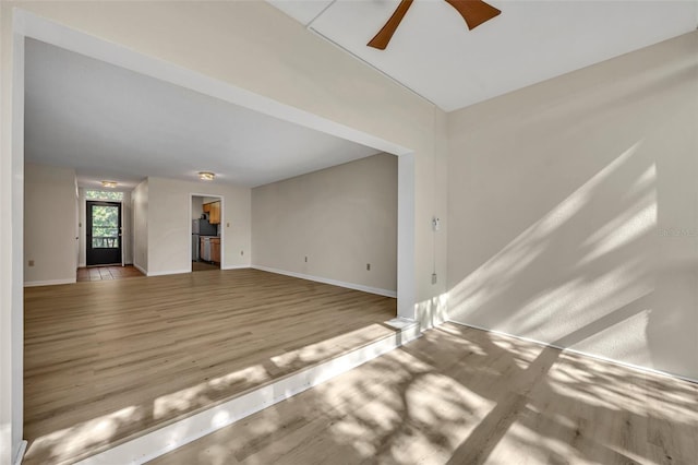 unfurnished living room with ceiling fan and light hardwood / wood-style floors