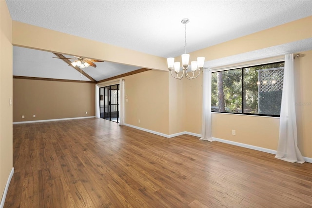 unfurnished room with hardwood / wood-style floors, ceiling fan with notable chandelier, lofted ceiling with beams, and a textured ceiling