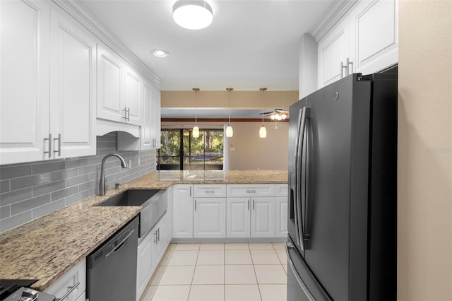 kitchen featuring sink, tasteful backsplash, stainless steel fridge with ice dispenser, dishwasher, and white cabinets