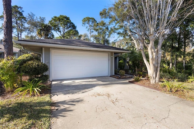 view of front of property featuring a garage and an outdoor structure