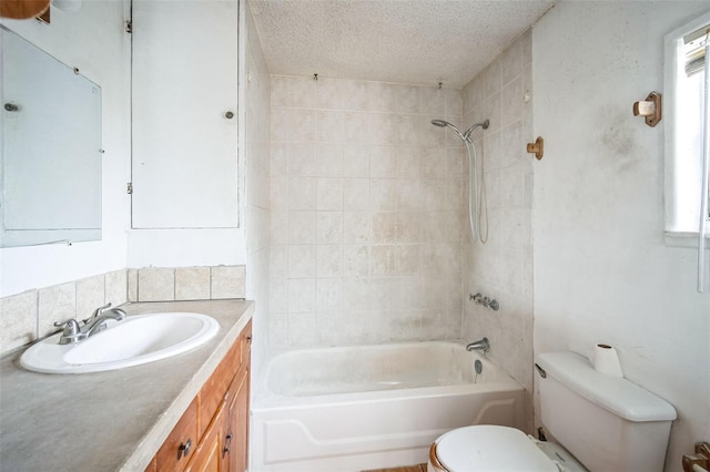 full bathroom featuring decorative backsplash, tiled shower / bath combo, vanity, toilet, and a textured ceiling