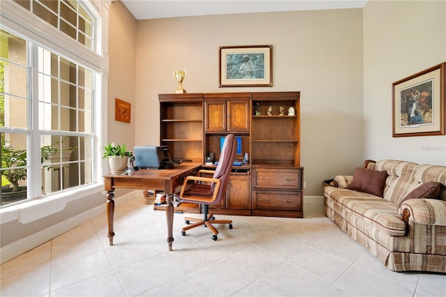 tiled home office with a towering ceiling