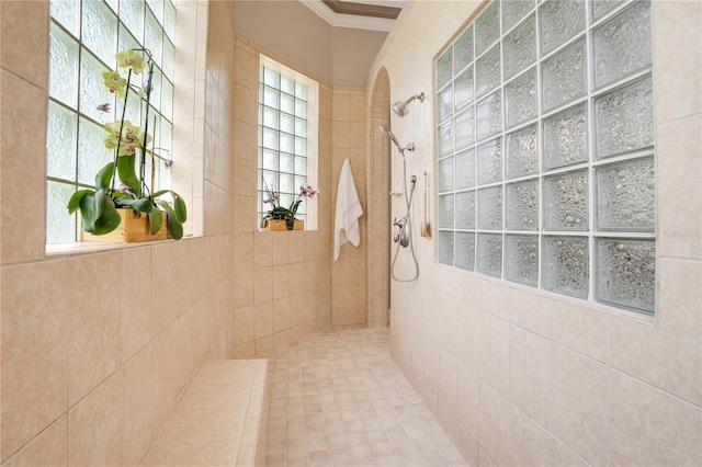 bathroom with a tile shower