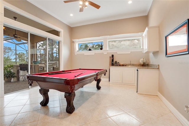 playroom with bar, light tile patterned floors, billiards, and ceiling fan