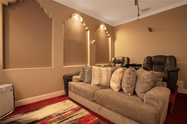 home theater room with crown molding and hardwood / wood-style flooring