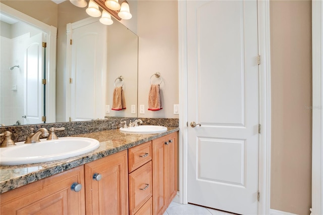 bathroom with vanity and tile patterned floors